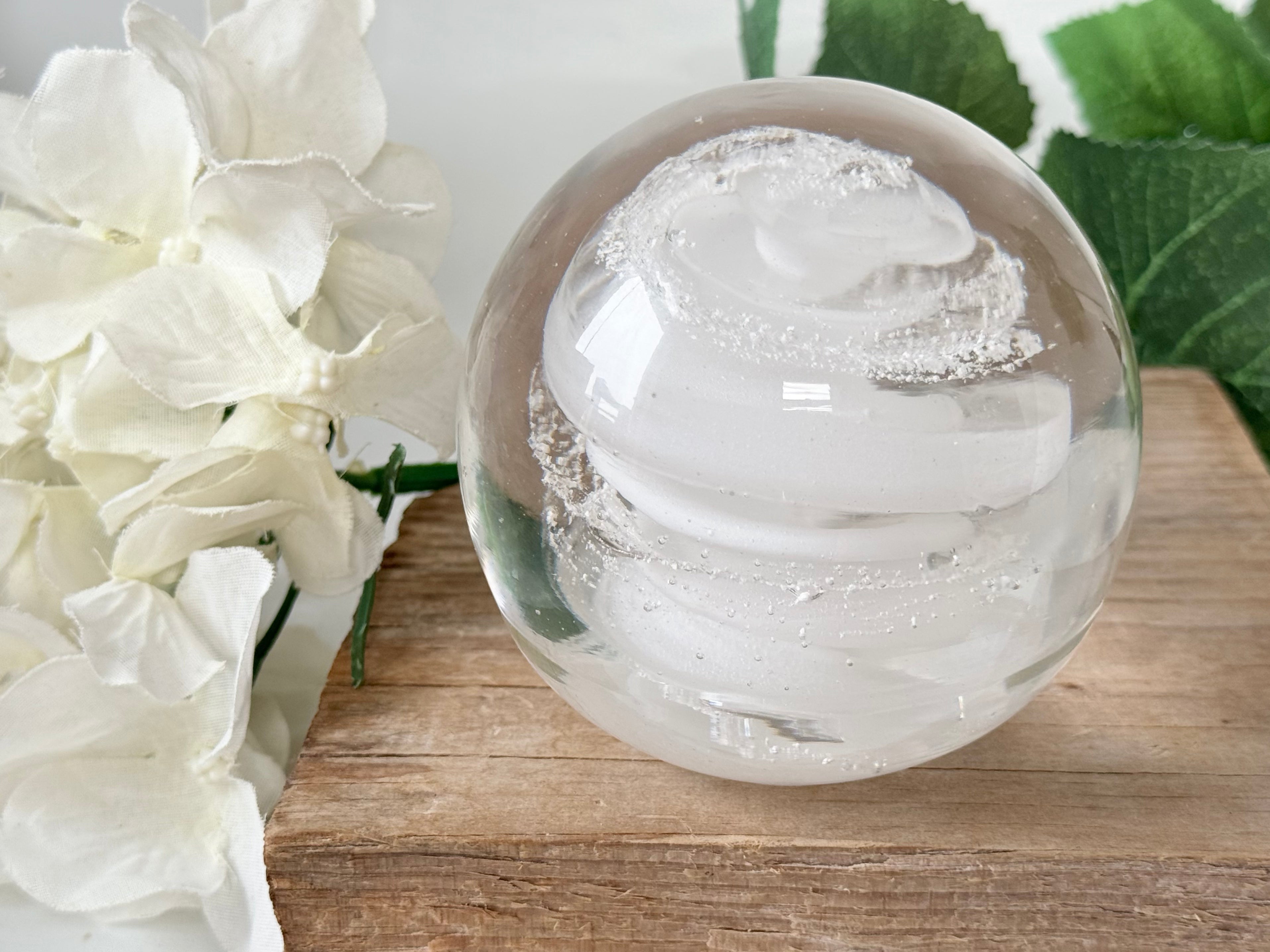 Glass “universe ball” with funeral ashes